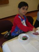 Gil decorating his edible Mt. Sinai Gil decorating his edible Mt. Sinai